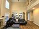 Open-concept living room with a fireplace, and views of the kitchen at 1988 Greensferry Gln, Lawrenceville, GA 30043