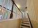 Hardwood staircase with white banisters leading to the upper level of the home at 1988 Greensferry Gln, Lawrenceville, GA 30043