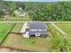 Aerial view of a home featuring a large yard, patio and manicured green lawn at 2243 Cain Cir, Dacula, GA 30019