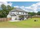 Large backyard featuring a patio area, a fence, and plenty of green space at 2243 Cain Cir, Dacula, GA 30019