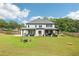 Aerial view of a backyard with a patio area, an outdoor seating area, and a fire pit at 2243 Cain Cir, Dacula, GA 30019