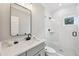 Modern bathroom featuring marble countertops, shower, and ceramic floors at 2243 Cain Cir, Dacula, GA 30019