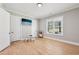 Bright bedroom featuring a window, closet, and sleek door at 2243 Cain Cir, Dacula, GA 30019