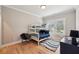Comfortable bedroom with hardwood floors, bunkbeds, and a cozy rug at 2243 Cain Cir, Dacula, GA 30019