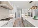 Modern kitchen with marble backsplash, stainless steel appliances, and wood accents at 2243 Cain Cir, Dacula, GA 30019