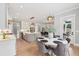 Bright, open kitchen with an island, modern appliances, and eat-in breakfast nook leading to a patio at 2243 Cain Cir, Dacula, GA 30019