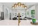 Open concept living area with eat in kitchen, fireplace and access to the stairway at 2243 Cain Cir, Dacula, GA 30019