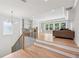 Open-concept living room with a stylish staircase and a built-in bar area at 2243 Cain Cir, Dacula, GA 30019