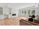 Comfortable living room featuring an electric fireplace and custom built-in shelving at 2243 Cain Cir, Dacula, GA 30019
