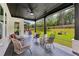 Covered patio area with outdoor seating, a fire pit, and a view of the backyard at 2243 Cain Cir, Dacula, GA 30019