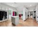 Large walk-in closet with custom shelving and center storage island at 2243 Cain Cir, Dacula, GA 30019