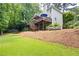 Sprawling backyard with a spacious deck, play area, and lush green lawn at 4522 Reva Ne Ct, Marietta, GA 30066