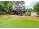 Expansive backyard view showcasing a large deck, ample green space, and a well-maintained landscape at 4522 Reva Ne Ct, Marietta, GA 30066