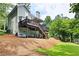 Backyard with a two-story deck featuring a pergola, outdoor seating, and lush green lawn at 4522 Reva Ne Ct, Marietta, GA 30066