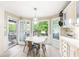 Cozy breakfast nook with large windows offering wooded views and access to the deck at 4522 Reva Ne Ct, Marietta, GA 30066