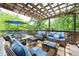 Outdoor deck with comfortable seating, pergola, and string lights perfect for entertaining at 4522 Reva Ne Ct, Marietta, GA 30066