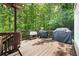 Enjoy grilling and outdoor dining on this spacious wooden deck surrounded by lush greenery at 4522 Reva Ne Ct, Marietta, GA 30066