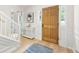 Inviting foyer with hardwood floors, a console table, and staircase at 4522 Reva Ne Ct, Marietta, GA 30066
