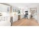 Charming kitchen boasts white cabinets, stainless steel appliances, and adjacent breakfast area at 4522 Reva Ne Ct, Marietta, GA 30066