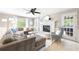 Spacious living room features a fireplace, ample seating, and natural light from large windows at 4522 Reva Ne Ct, Marietta, GA 30066