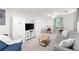 Cozy living room with modern furnishings, media storage, and a well-lit workspace at 4522 Reva Ne Ct, Marietta, GA 30066