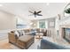 Bright living room with fireplace, ample seating, and natural light creates a cozy space at 4522 Reva Ne Ct, Marietta, GA 30066