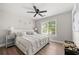 Cozy bedroom with a plush white bed, stylish nightstands, and soft lighting, creating a relaxing retreat at 900 Ira Sw St, Atlanta, GA 30310