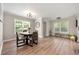 Spacious dining area featuring hardwood floors, lots of light, and a seating area at 900 Ira Sw St, Atlanta, GA 30310