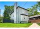 Rear view of home with gray siding and a tall chimney at 900 Ira Sw St, Atlanta, GA 30310