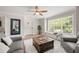 Beautiful living room with hardwood floors, a decorative rug, and natural light from the large window at 900 Ira Sw St, Atlanta, GA 30310