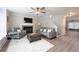Inviting living room featuring hardwood floors, a fireplace, and modern furniture, perfect for relaxing and entertaining at 900 Ira Sw St, Atlanta, GA 30310