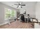 Home office with large window, ceiling fan and light wood floors providing a great work environment at 900 Ira Sw St, Atlanta, GA 30310