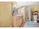 Bathroom featuring a vanity with a sink, toilet, and a walk-in shower at 1561 Annapolis Way, Grayson, GA 30017