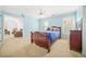 Bedroom with blue walls, carpet, and windows at 1561 Annapolis Way, Grayson, GA 30017