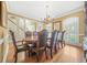 Formal dining room featuring a large wooden table and elegant chairs at 1561 Annapolis Way, Grayson, GA 30017