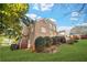 Exterior of house with a view of the backyard and a lush, well-manicured lawn at 1561 Annapolis Way, Grayson, GA 30017