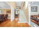 Bright foyer with hardwood floors, staircase, and views into the living areas at 1561 Annapolis Way, Grayson, GA 30017