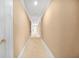 Hallway with beige walls and carpet at 1561 Annapolis Way, Grayson, GA 30017