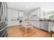 Bright kitchen featuring white cabinetry, stainless steel appliances, and a center island at 1561 Annapolis Way, Grayson, GA 30017