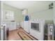 Well-equipped laundry room featuring modern appliances and ample storage space at 1561 Annapolis Way, Grayson, GA 30017