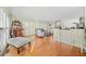 Bright living space with hardwood floors, a bar area, and large windows at 1561 Annapolis Way, Grayson, GA 30017