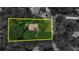 Aerial view of property, outlined in yellow, showcasing the home's setting within a lush, tree-filled landscape at 270 Hollyridge Way, Roswell, GA 30076