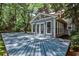 Outdoor deck with ample space for entertaining and views of the yard at 270 Hollyridge Way, Roswell, GA 30076