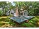 Spacious backyard with a large deck and mature trees providing ample shade and privacy at 270 Hollyridge Way, Roswell, GA 30076