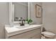 Cozy powder room featuring a modern sink, faucet, and decorative artwork at 270 Hollyridge Way, Roswell, GA 30076