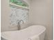 Freestanding tub under a window, creating a luxurious bathing experience at 270 Hollyridge Way, Roswell, GA 30076