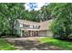 Charming two-story home with a well-manicured lawn and mature trees, creating a serene and inviting curb appeal at 270 Hollyridge Way, Roswell, GA 30076