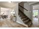 Inviting foyer with hardwood floors, a staircase, and stylish decor, creating a warm and welcoming entrance at 270 Hollyridge Way, Roswell, GA 30076