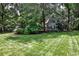 Charming home nestled among lush greenery in a well-maintained front yard at 270 Hollyridge Way, Roswell, GA 30076