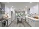 Bright, all-white kitchen featuring modern appliances, stylish countertops, and ample cabinet space at 270 Hollyridge Way, Roswell, GA 30076